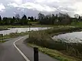 The dead hedge alongside this cycleway is protecting a wildlife pond among the 'Kingfisher Pools' at St Nicholas' Park, Warwick, England.