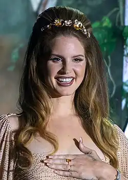 Lana Del Rey smiling at a festival performance
