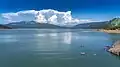 Storm clouds build near Crater Lake in the distance, and reflect in the waters of Lost Creek Lake, Oregon.