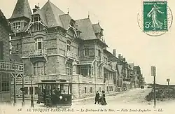 Town tram turning from the beach towards the city