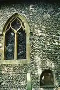 The south side of the chancel, showing a blocked aperture through which an anchorite would once have received the Blessed Sacrament