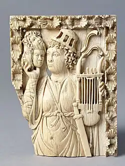Early 6th century A.D., Trier. Roman culture, a mime with mask and a lyre. Germans took over Trier in the mid-5th century A.D. Shape of lyre resembles that in the Charles the Bald Bible.