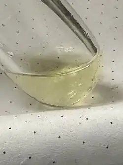A sample of liquefied ketene (ethenone) at -60 °C, yellow due to polymerization
