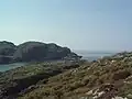 Loch Roe. Looking south over the entrance to Loch Roe with Enard Bay in the west. The headland in the distance is Rubha na Coigich.