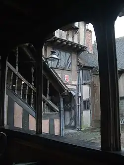 Under the gallery in the courtyard of the hospital