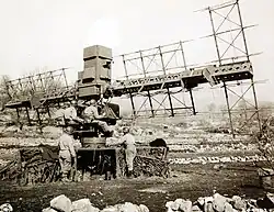 Three soldiers operating an SCR-268 with two soldiers standing nearby.