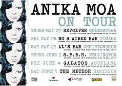 A white poster reading 'Anika Moa on tour', with venues and sponsors below. Four copies of the cover art of Love in Motion are on the left edge of the poster