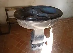 The baptismal font.