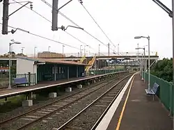 Lysaghts railway station, in Australia, with two side platforms and a footbridge connecting them