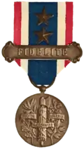 The arms emblazoned onto the reverse side of the Medal for Fidelity to France [fr], instituted in 1922