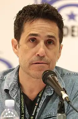 Mac Quayle talking in a microphone