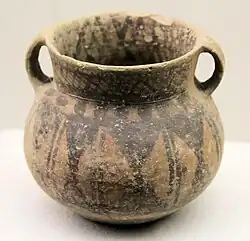 Pot with standing human shapes
