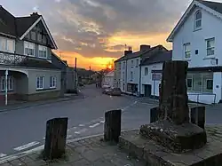 Centre of the village of Maiden Newton with the village cross in foreground