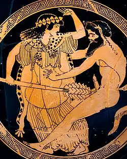 An ithyphallic satyr grasps a draped maenad