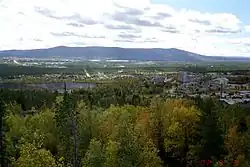 Malmberget. "The Pit" is visible in the centre-left of the image. In the background Gällivare and the Dundret mountain.