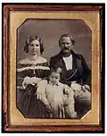 Manuela Ferrer Scarpetta and George Henry Isaacs, the poet's parents, with another of their children.