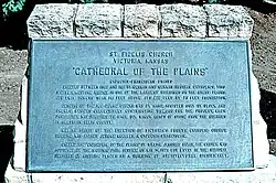 Plaque outside the church (1997)