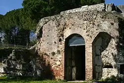 Color photograph of a masonry wall with a door.