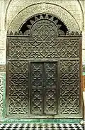 Wooden mashrabiya screen at the entrance of the courtyard