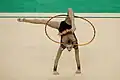 Catching the hoop between the neck and leg (Melitina Staniouta)