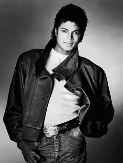 Black and white picture of Michael Jackson standing up for a picture