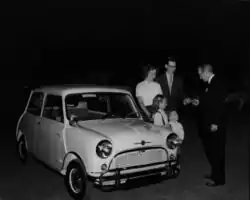 The first Morris Mini-Minor sold in Texas being delivered to a family in Arlington, Texas, in 1959