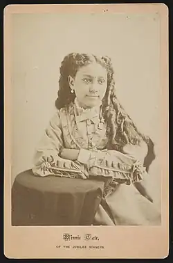 A 19c. photograph of Minnie Tate, a young African-American singer.