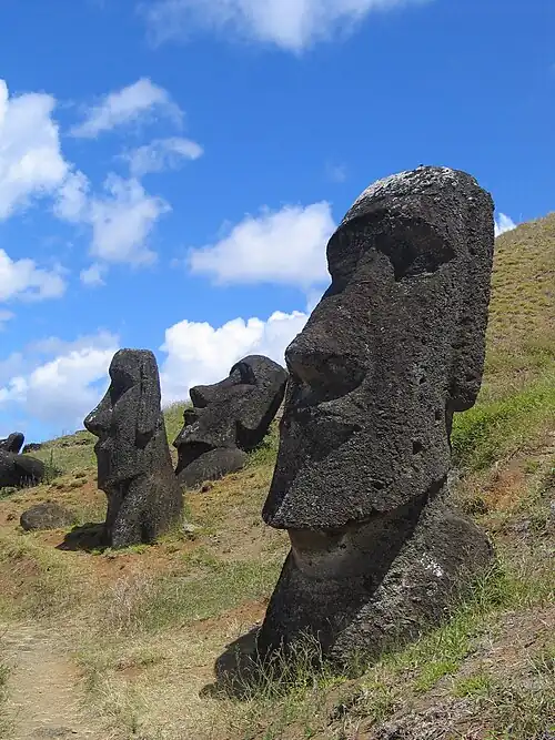 Stone statues of human heads and torsos