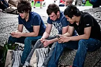 Image 34Young men in London, 2010, wearing slim-cut jeans and layered T-shirts and polos, typical of middle-class streetwear influenced by Abercrombie & Fitch. (from 2010s in fashion)