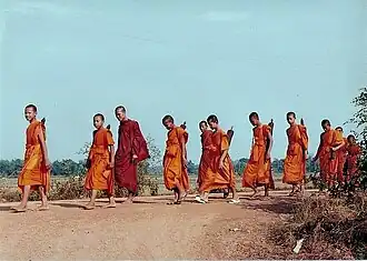 Buddhist monks in the Theravada tradition typically wear saffron robes. Although occasionally maroon, the colour normally worn by Vajrayana Buddhist monks is orange.
