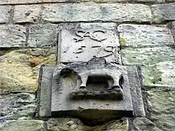 Insignia of Sir Andrew Corbet above gatehouse door