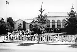 Children salute the American flag in front of the school in Morgan Hill, California, in the 1930s