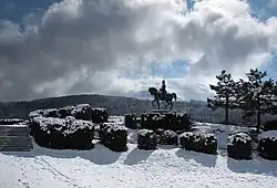 Photo of a statue of Napoleon overlooking a snow-covered scene