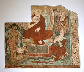 Painting of a cowherd listening to a sermon of the Buddha, from the right wall of the main hall. Cave of the Statues. 14C date: 406-425 AD.[133]