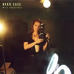 A photo of Case in a mirror photographing herself