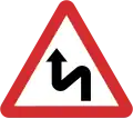B12: Double curve ahead first to the left