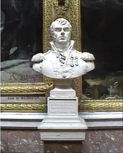 Bust of man with a dimple on his chin. He wears an early 1800s military uniform with a high collar.