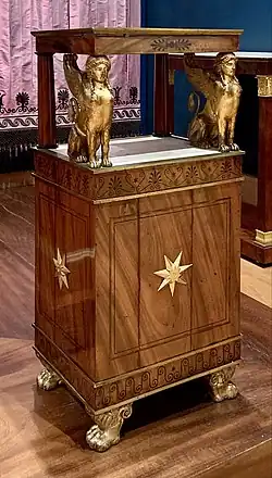 Neoclassical palmettes on a nightstand, from the bedroom of Madame Récamier, by Georges II Jacob and François-Honoré-Georges Jacob-Desmalter, before 1799, mahogany, ebony, copper, gilt bronze mounts and white marble, Louvre