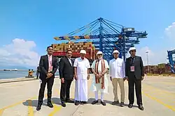 chief minister of Kerala Pinarayi Vijayan and Prime minister Narendra Modi at the port, surrounded by other men