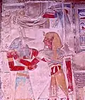 Painted Relief of Seti I embraced by Wepwawet. Nearby hieroglyphs and elements, e.g. the pupils of the eyes, which are usually painted black, also appear grey or white.