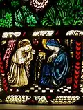 One of three vignettes at the base of the window. The Annunciation. Gabriel tells Mary the good news.