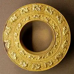 Reel (probably an ear-stud) with representations of Pegasus and Chimaira