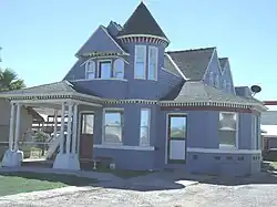 The Morse-Kelley House was built in 1912 and is located at 2141 W. Madison St. The house takes its name from Menzo Morse, a grocer, and Dorrian Kelley, a salesman for the Standard Oil Co., each of whom lived there for a time. Designated as a landmark with Historic Preservation-Landmark (HP-L) overlay zoning. It was listed in the Phoenix Historic Property Register.