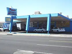 The Paris Laundry and Dry Cleaning Building was built in 1957. It is located 4130 N. 7h Avenue. This building was designed Googie style. Googie architecture is a form of modern architecture influenced by the Space Age and the Atomic Age. The building is considered historical by the Phoenix Historic Preservation Office.