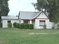 The Tudor Revival Residence located at 106 E. Greenway Road was built in 1931. It was listed in the Phoenix Historic Property Register in July 1993.