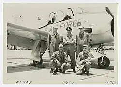 Photograph of men in front of a U.S. Air Force plane, Bainbridge, Georgia, 1956