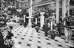 Interior view of Podesta and Baldocchi florist shop showing floral displays and store layout