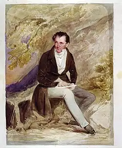 Two small figures sit on a cliff top above a river, which snakes through a wooded gorge towards the distant sea. Small boats sail along the river.