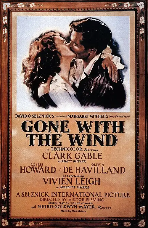 A film poster showing a man and a woman in a passionate embrace.