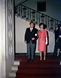 President Kennedy wears a black lounge to a diplomatic reception at the White House in 1961
